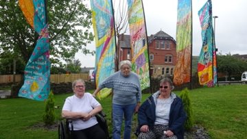 Hand painted flags fly for Sandon House Residents